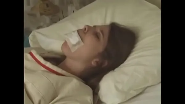 Pretty brunette in Straitjacket taped mouth tied to bed hospital Film terpopuler baru